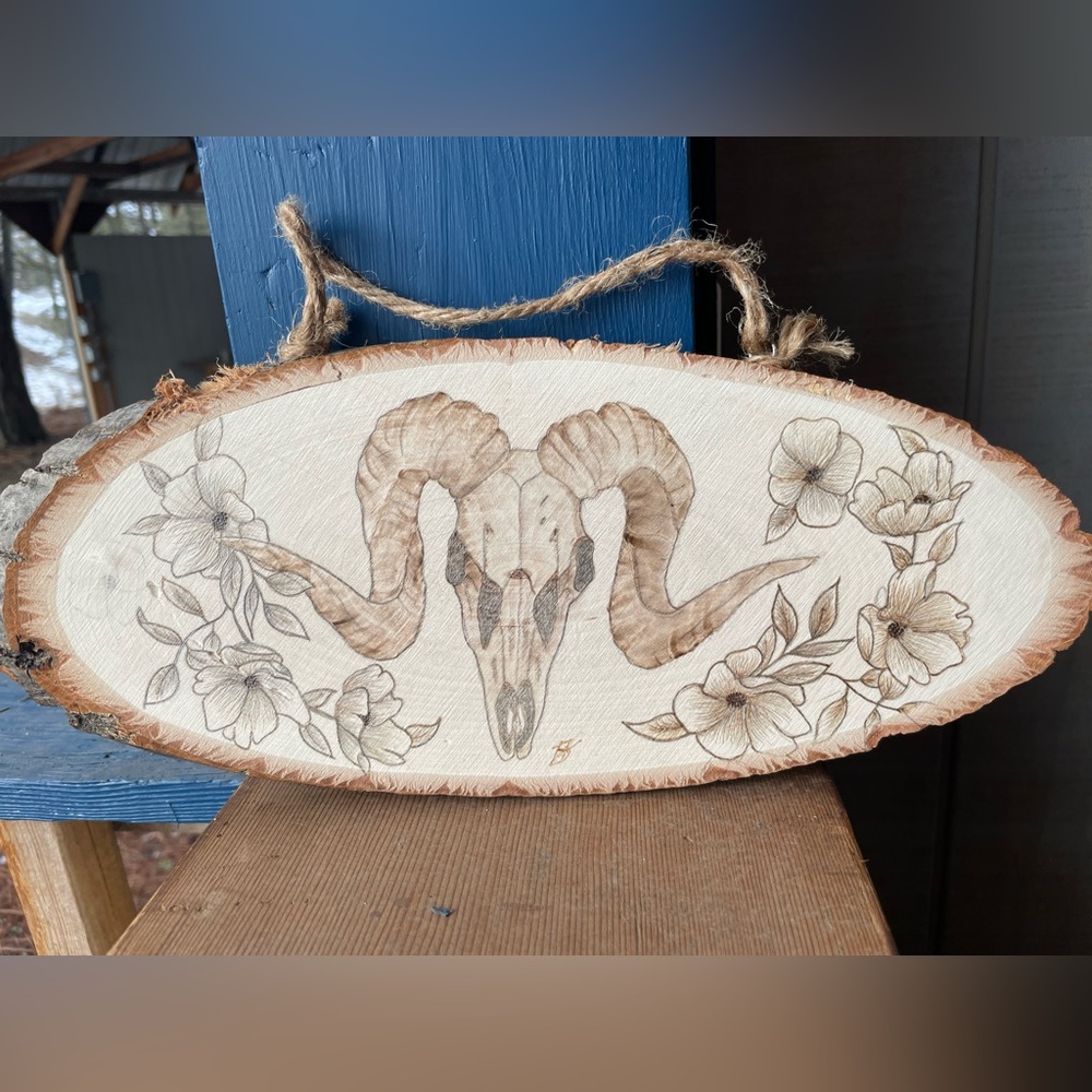 Ram skull with flowers. Wood burned by me. 13x5